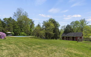 Expansive, Meticulously Landscaped Lot with Barn