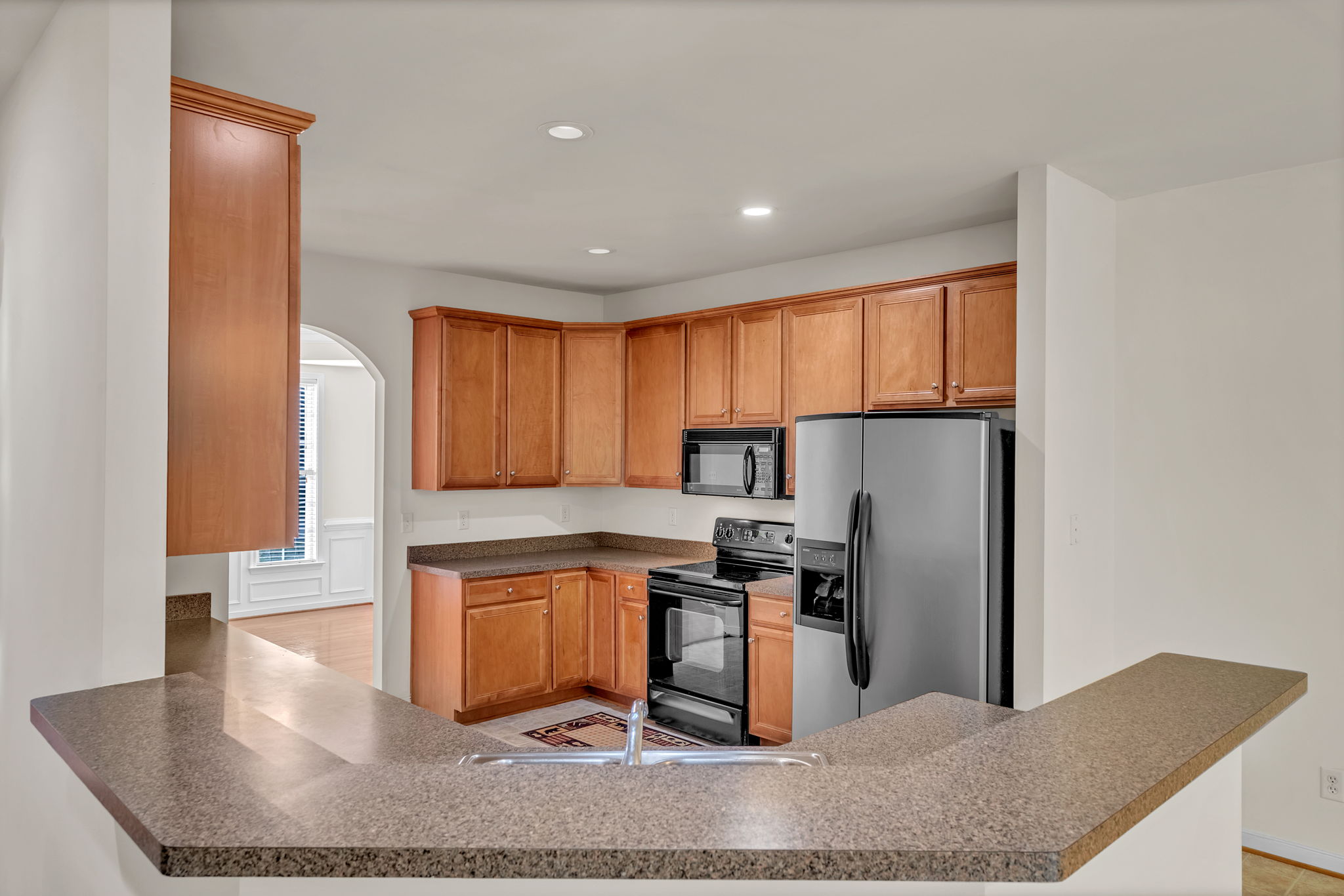 KITCHEN OPEN VIEW TO FAMILY RM