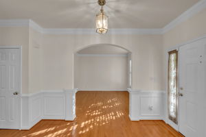 FOYER W/ WAINSCOTING LIVING RM VIEW