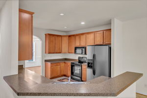 KITCHEN OPEN VIEW TO FAMILY RM