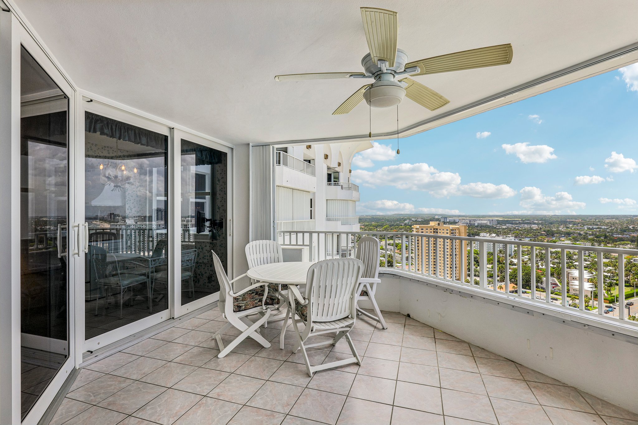 Large terrace with space for plenty of chairs and a dining table.