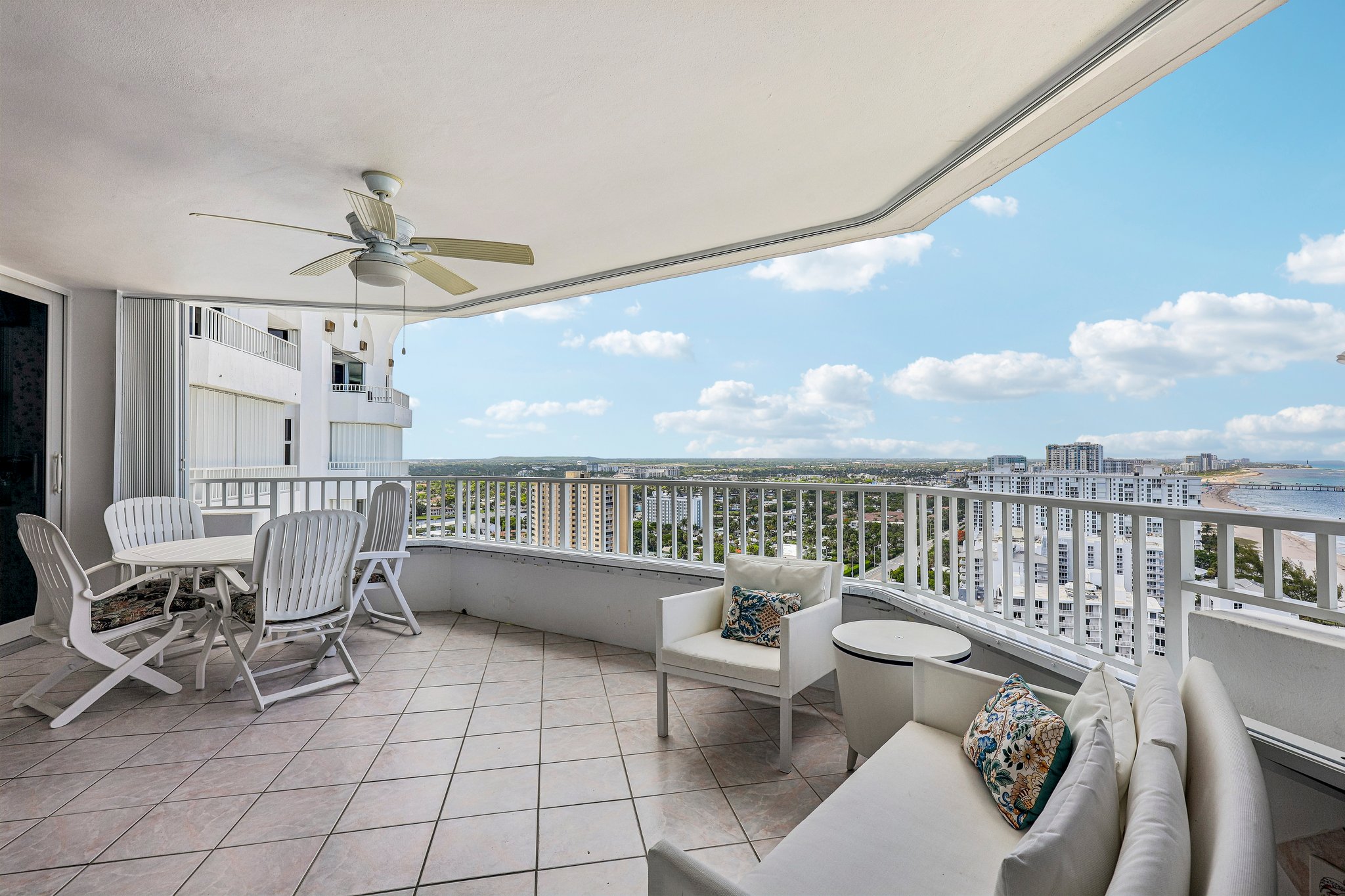 Large terrace with space for plenty of chairs and a dining table.