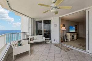 Large terrace with space for plenty of chairs and a dining table.