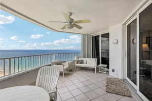 Large terrace with space for plenty of chairs and a dining table.