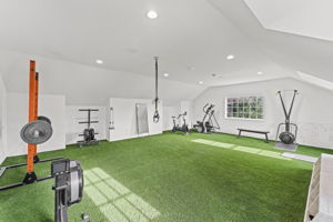 Expansive Gym with Turf/ Swing Room