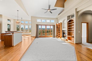 Living room with Built-ins, Fireplace, Sliding Doors to Deck