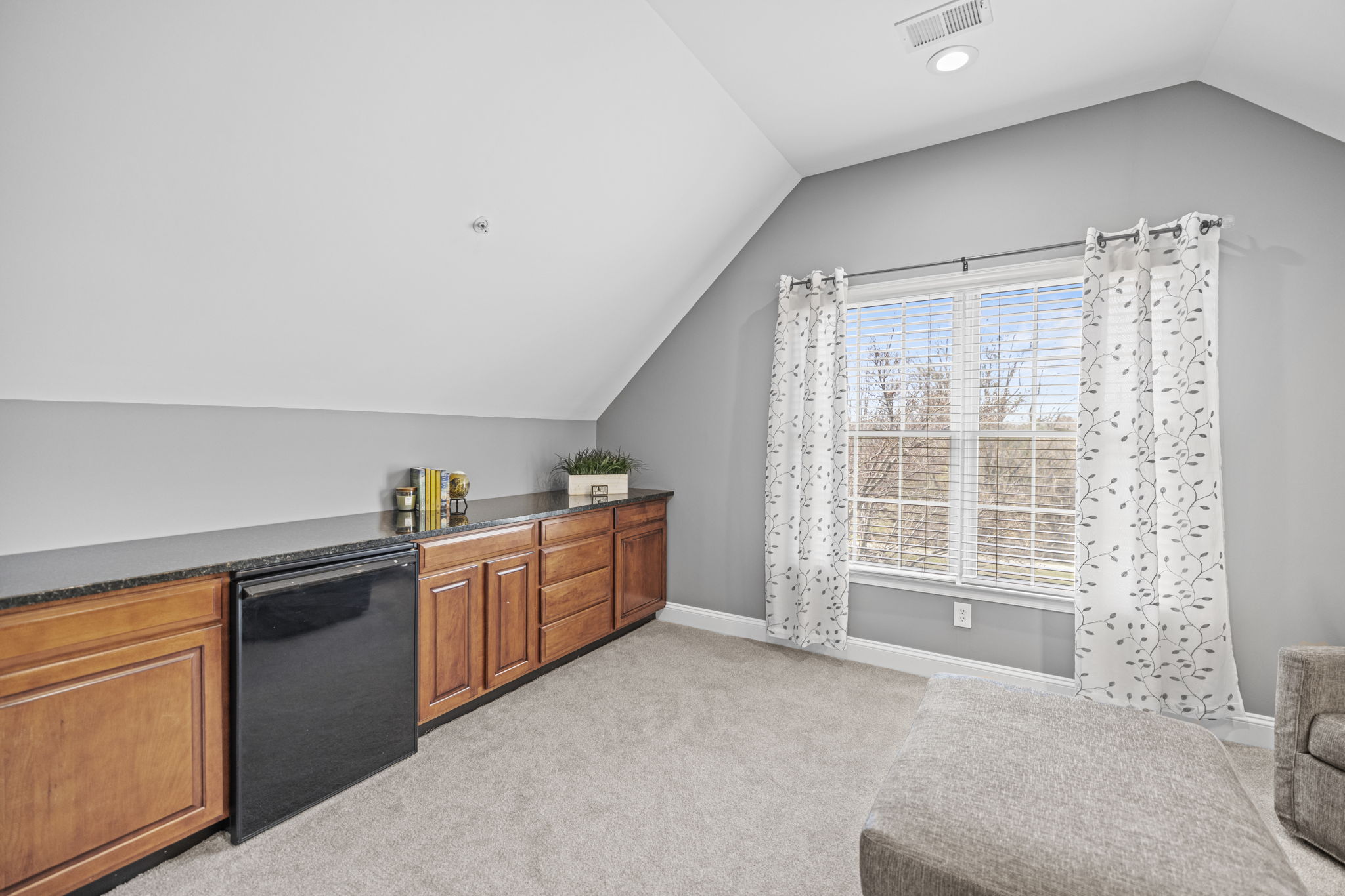 Primary Sitting Room with Bar Refrigerator