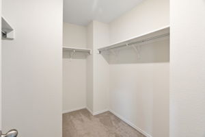 Primary bedroom walk-in closet