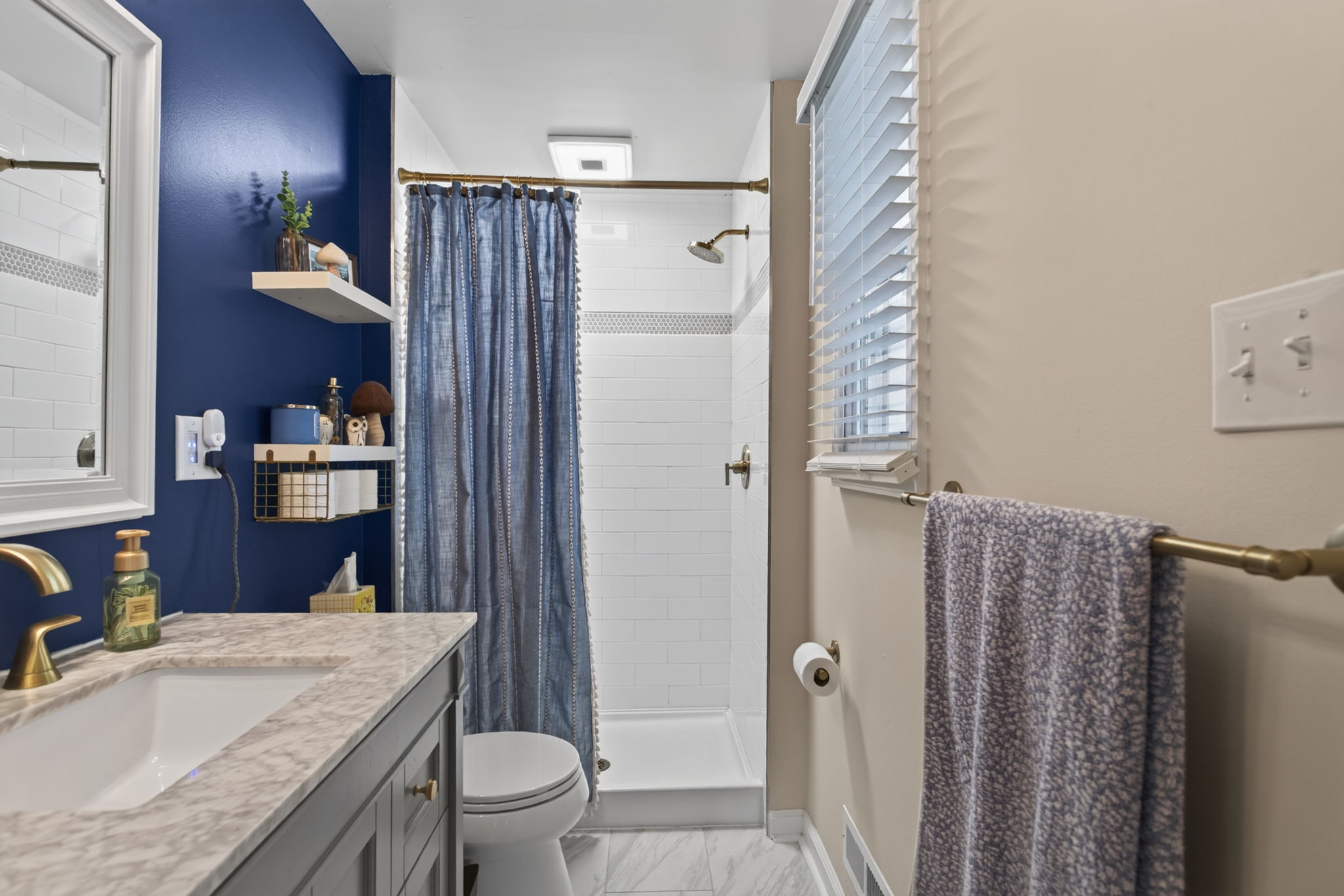 Modern Bath Finishes with updated Walk-In Shower.