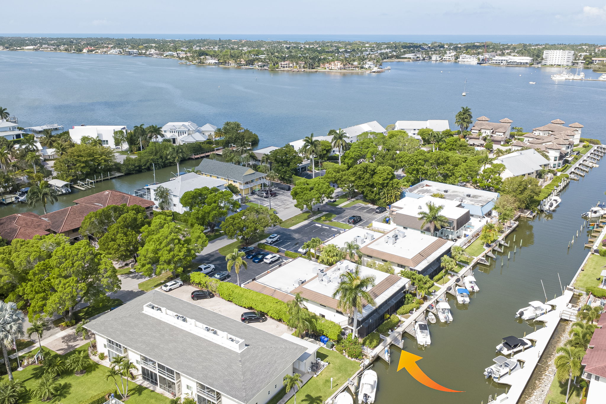 Aerial drone photography capturing the expansive waterfront community, coastal landscape, and proximity to deep-water boating channels.