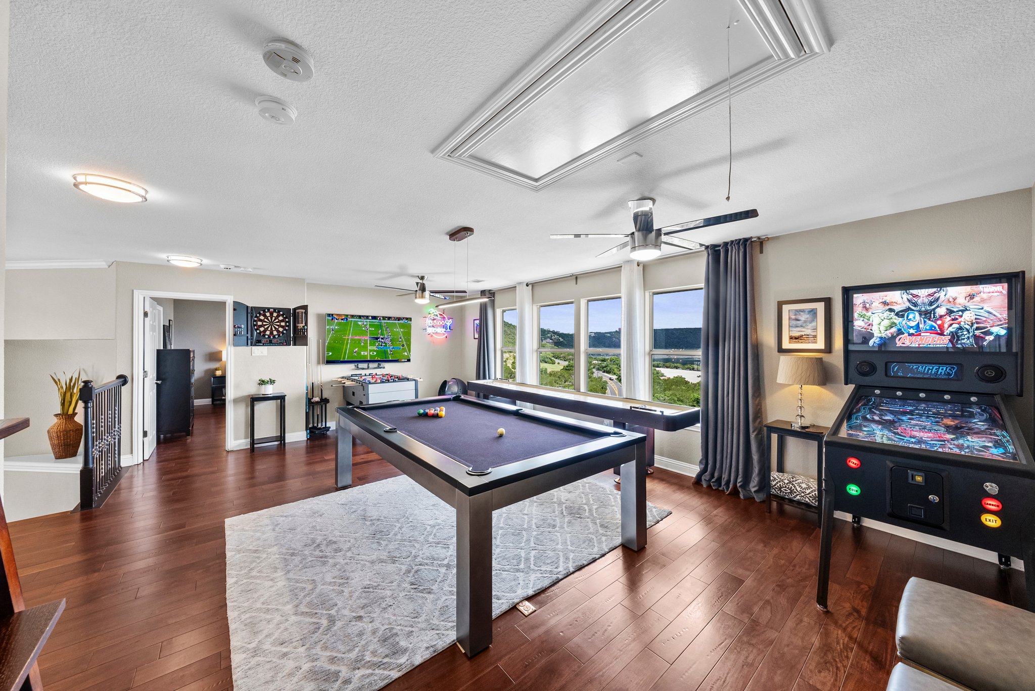 The upper-level living area is quite spacious and offers incredible views of Lake Travis