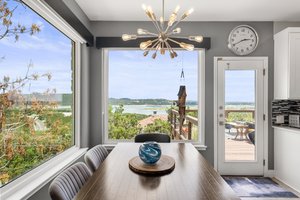 Breakfast area near the kitchen surrounded by windows to take in the view of Lake Travis
