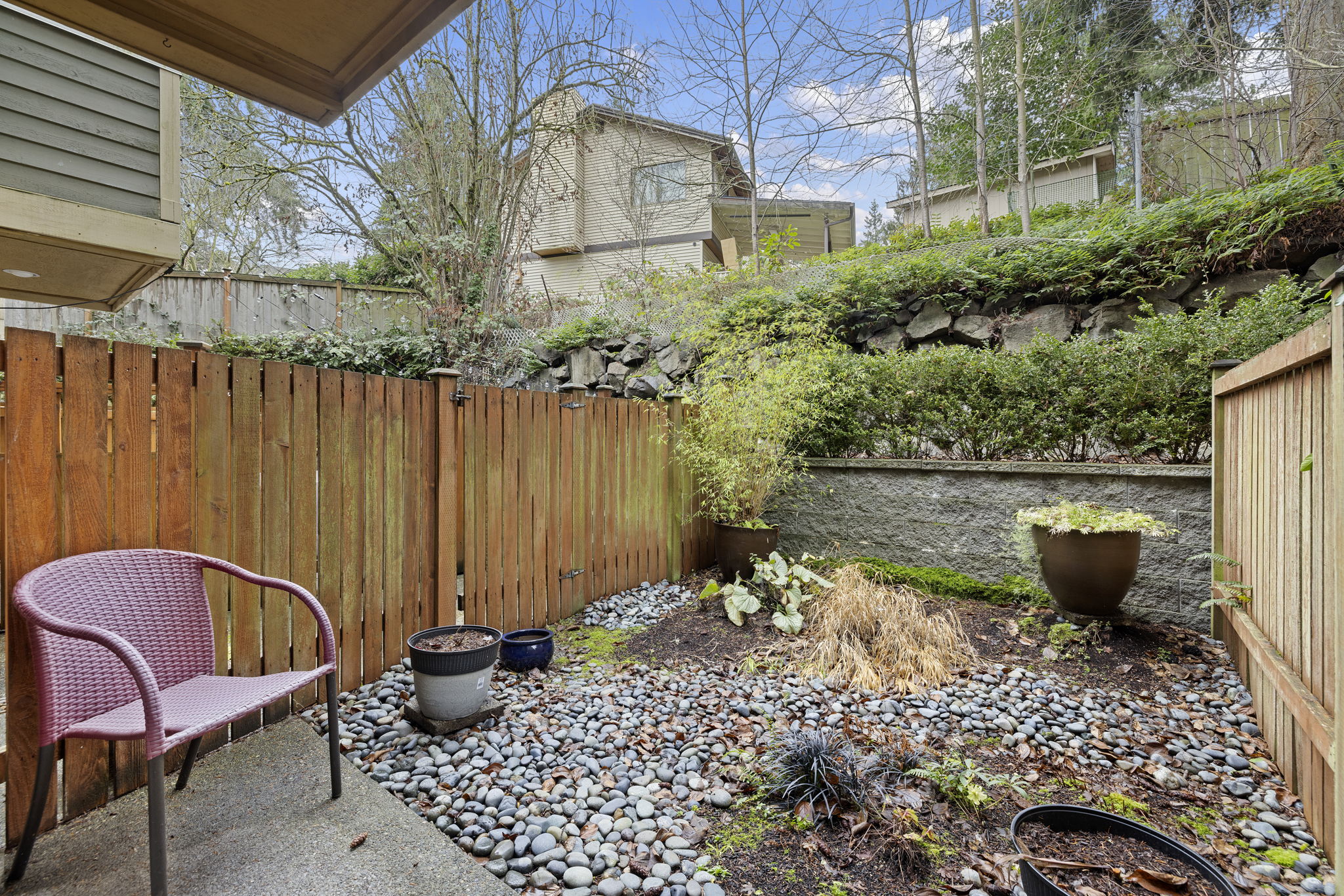 Outdoor patio with fenced low-maintenance yard.