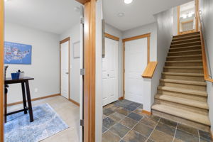 Townhouse style living w/lower level guest/office room & access to the outdoor patio w/fenced low-maintenance yard.