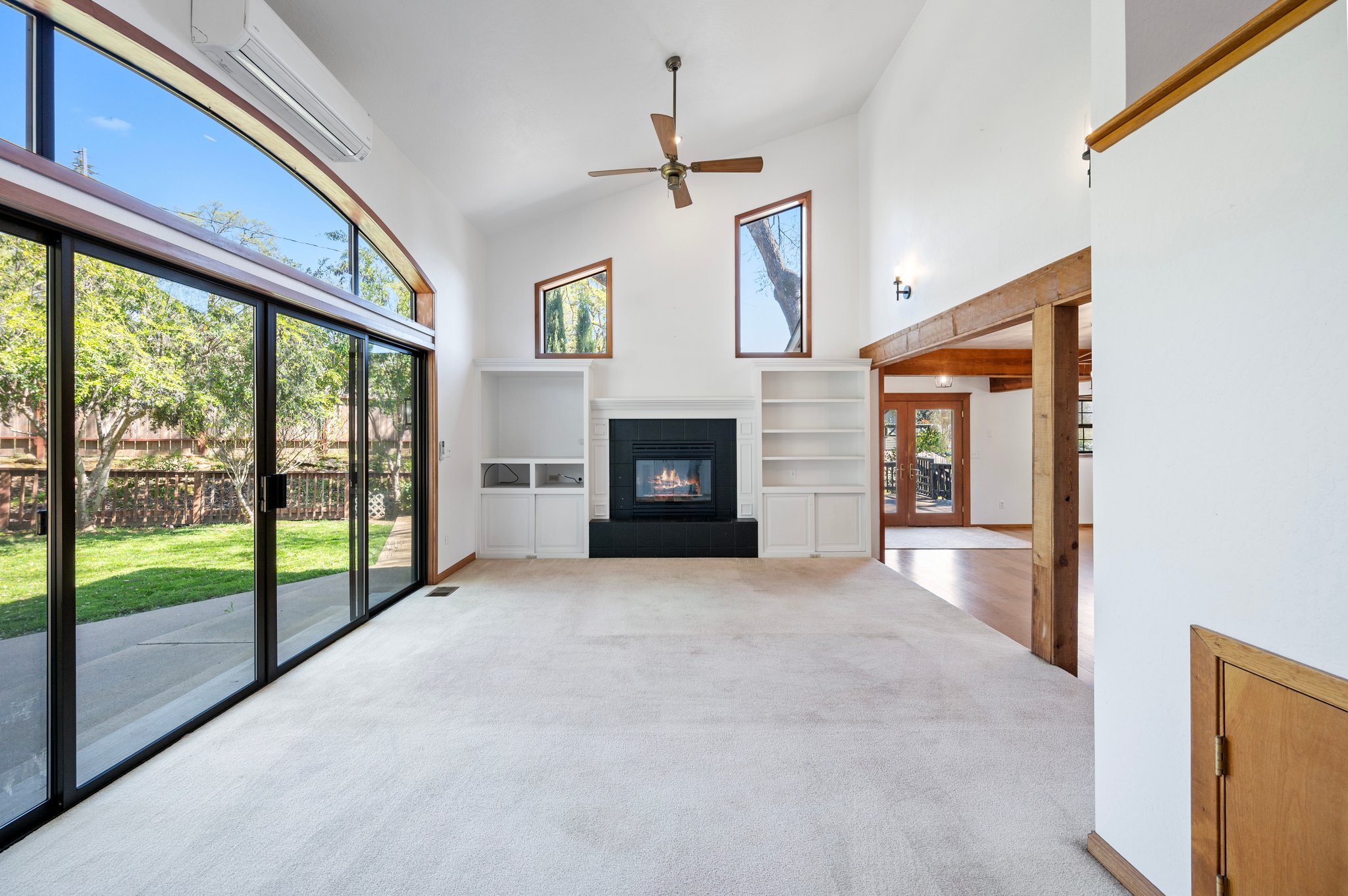 Fireplace in Living Room w/Double sliding Door's and Upper Window