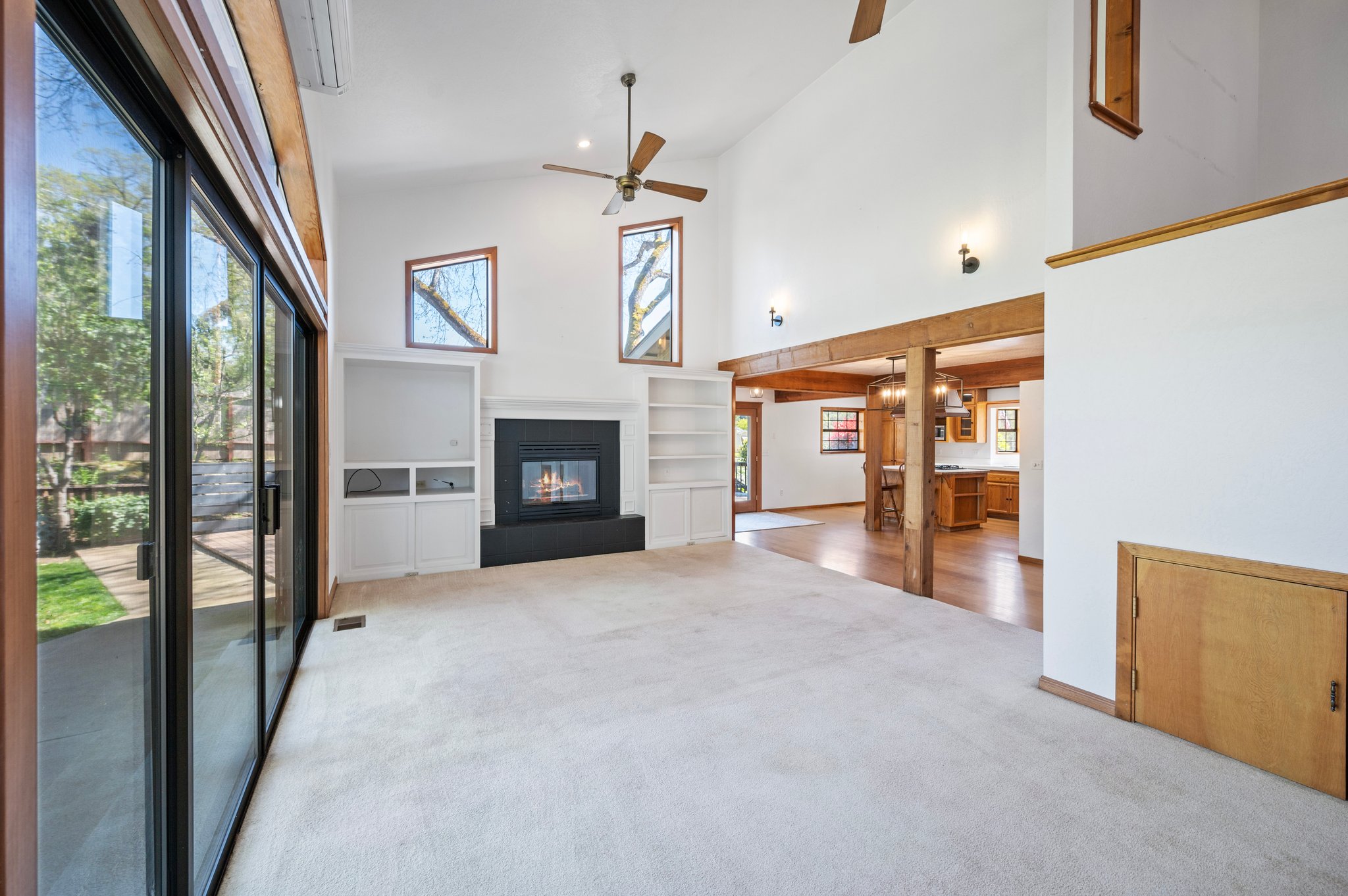 Fireplace in Living Room w/Double sliding Door's and Upper Window