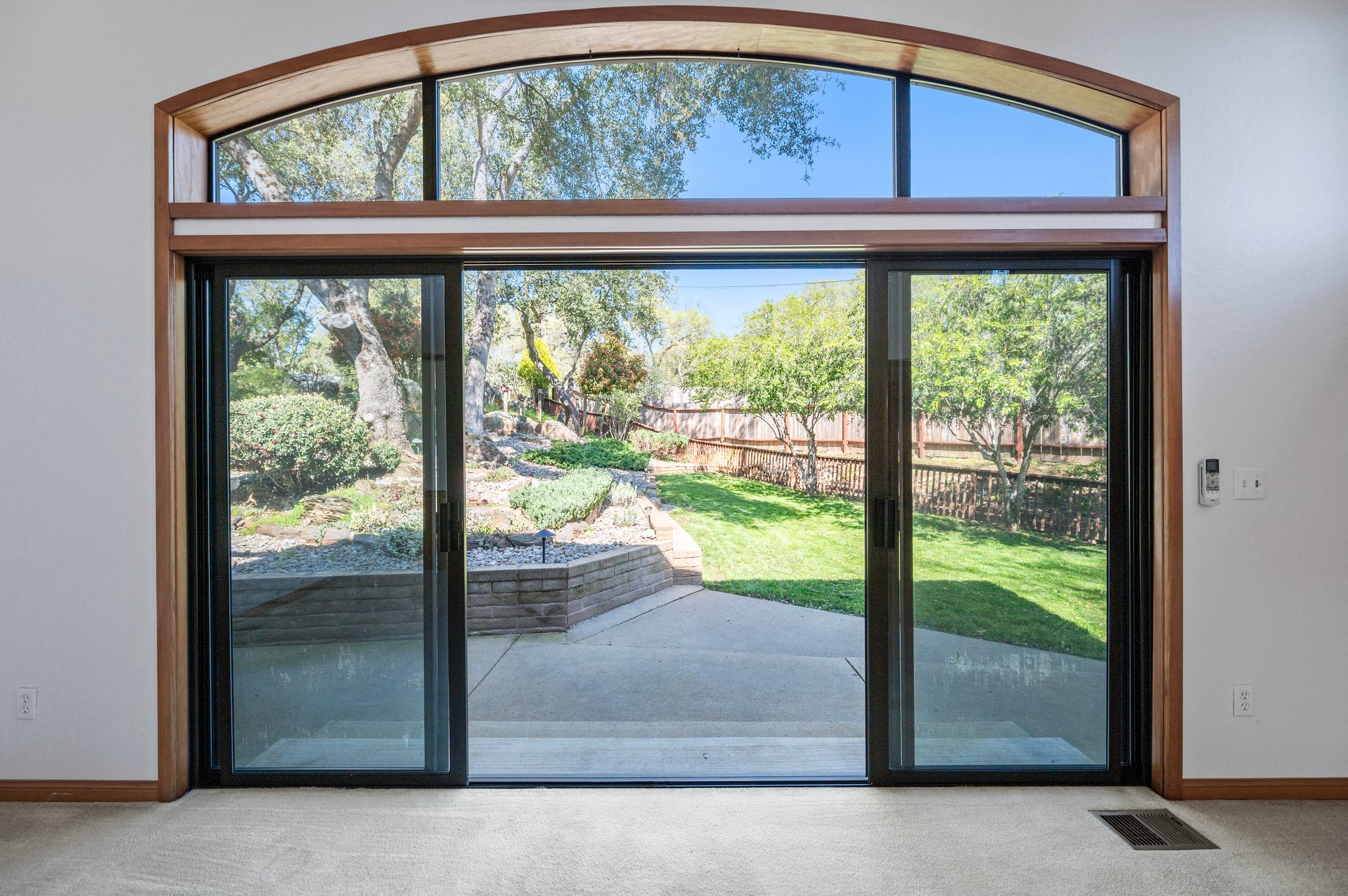 Views through Double Sliding Doors to Back Yard