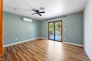 Upper Bedroom w/Sliding Door to Balcony