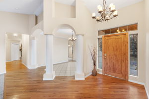 Foyer with large hardwood door