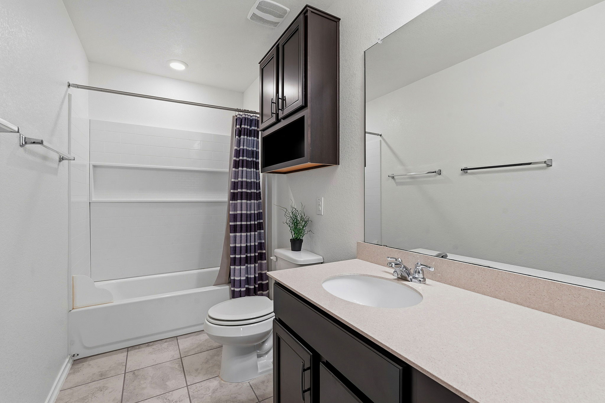 Secondary bath located upstairs by the bedrooms and loft.