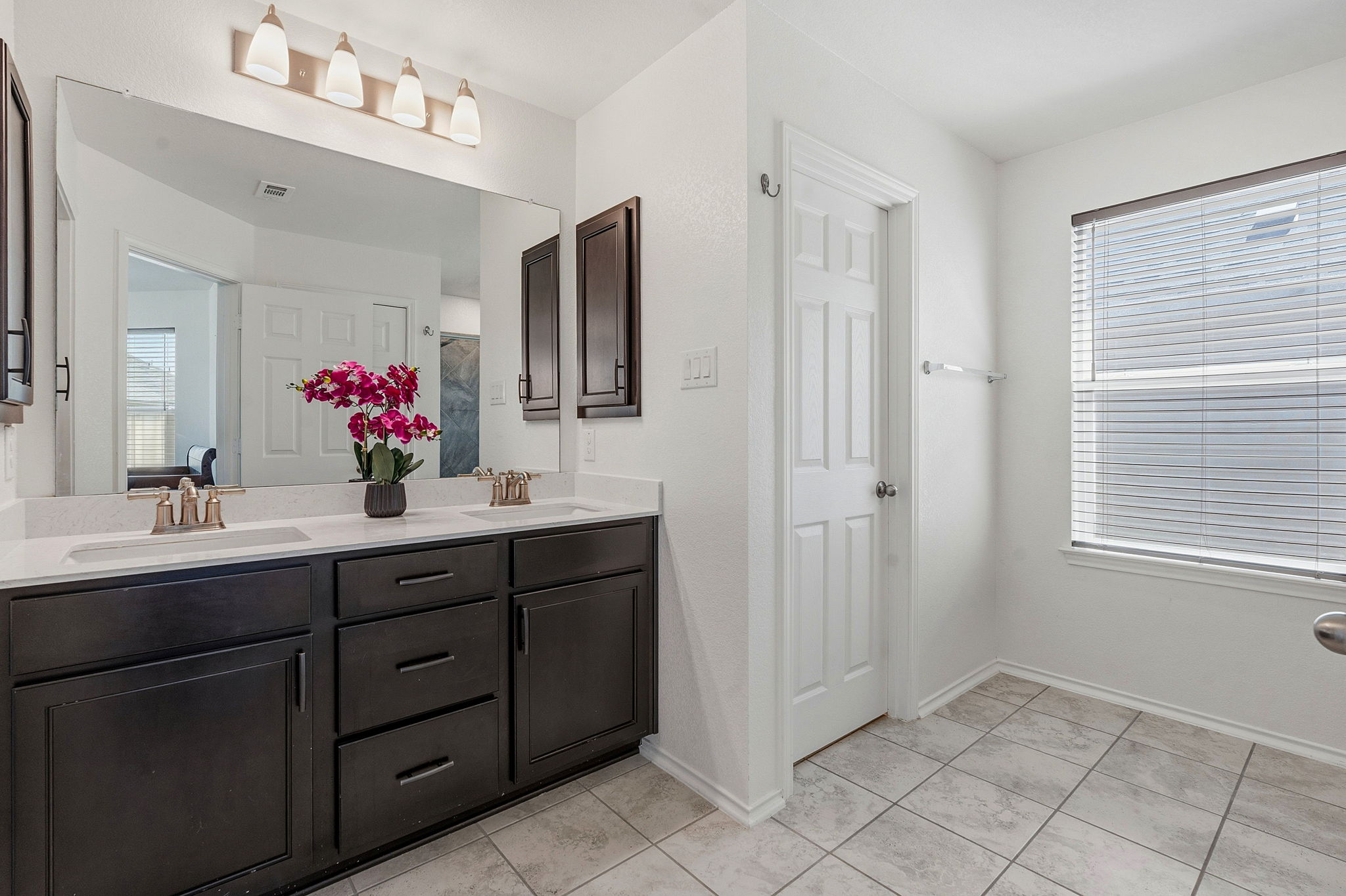Separate water closet in the primary bath.