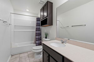 Secondary bath located upstairs by the bedrooms and loft.