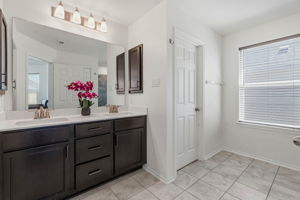 Separate water closet in the primary bath.