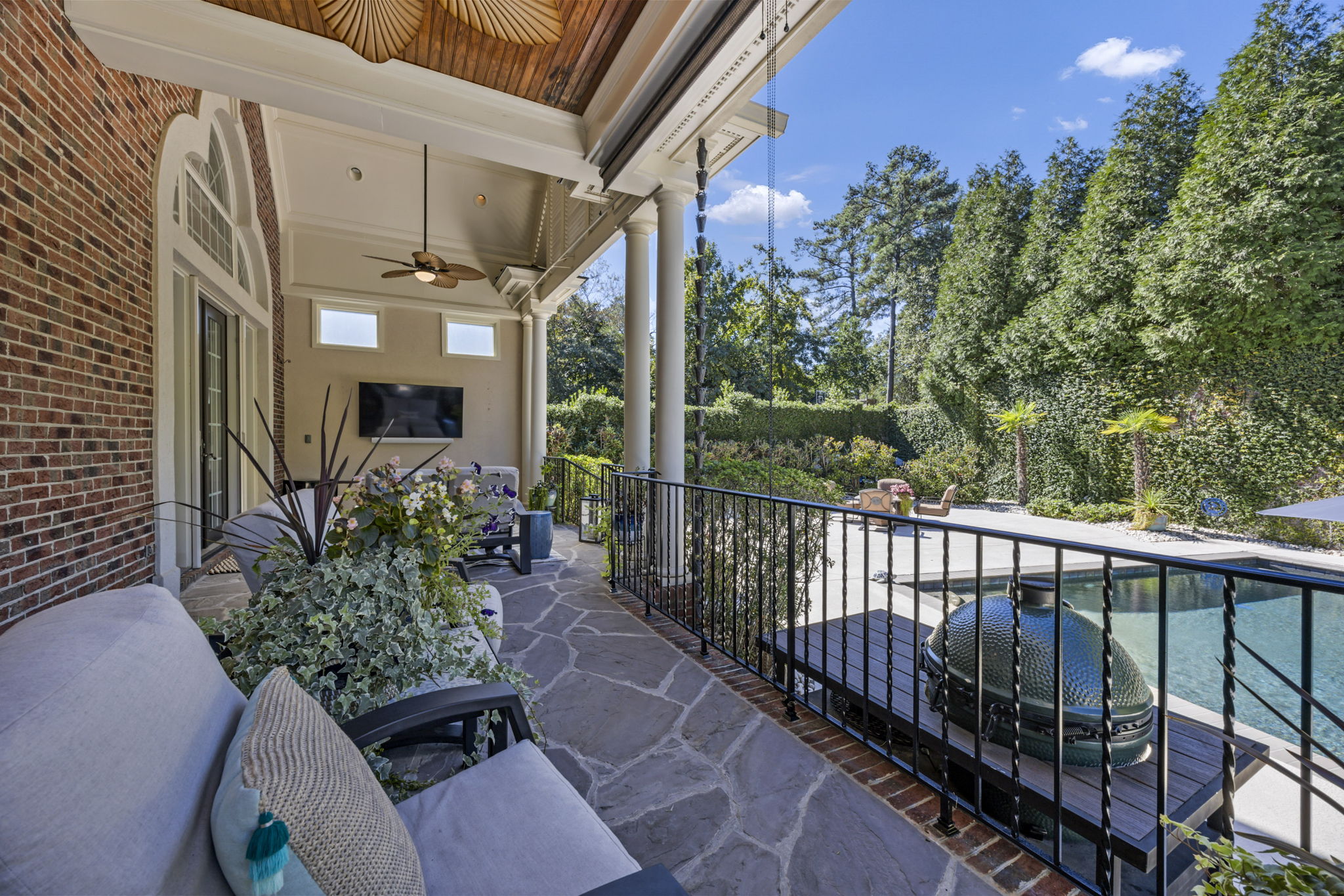 back porch from guest suite side - notice the rain chain and the 2 roller shades!