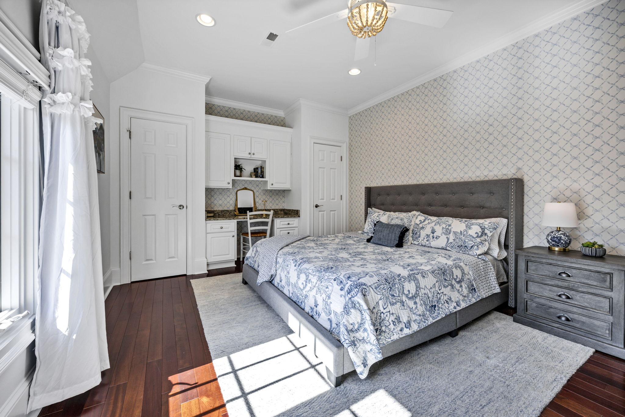 upstairs bedroom 3 w ensuite hall bath and built-in desk area, 2 closets