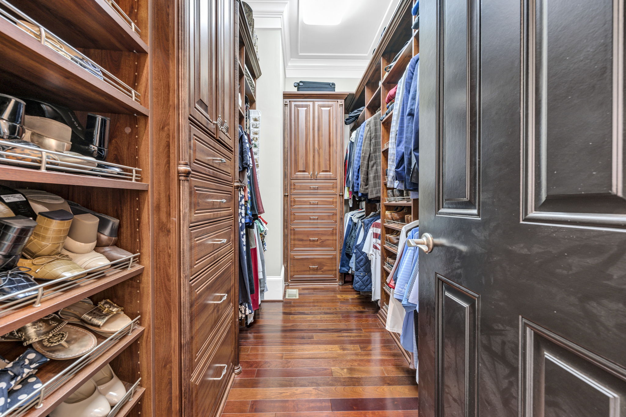 primary walk-in closet (2 other closets in bedroom) w California Closets design