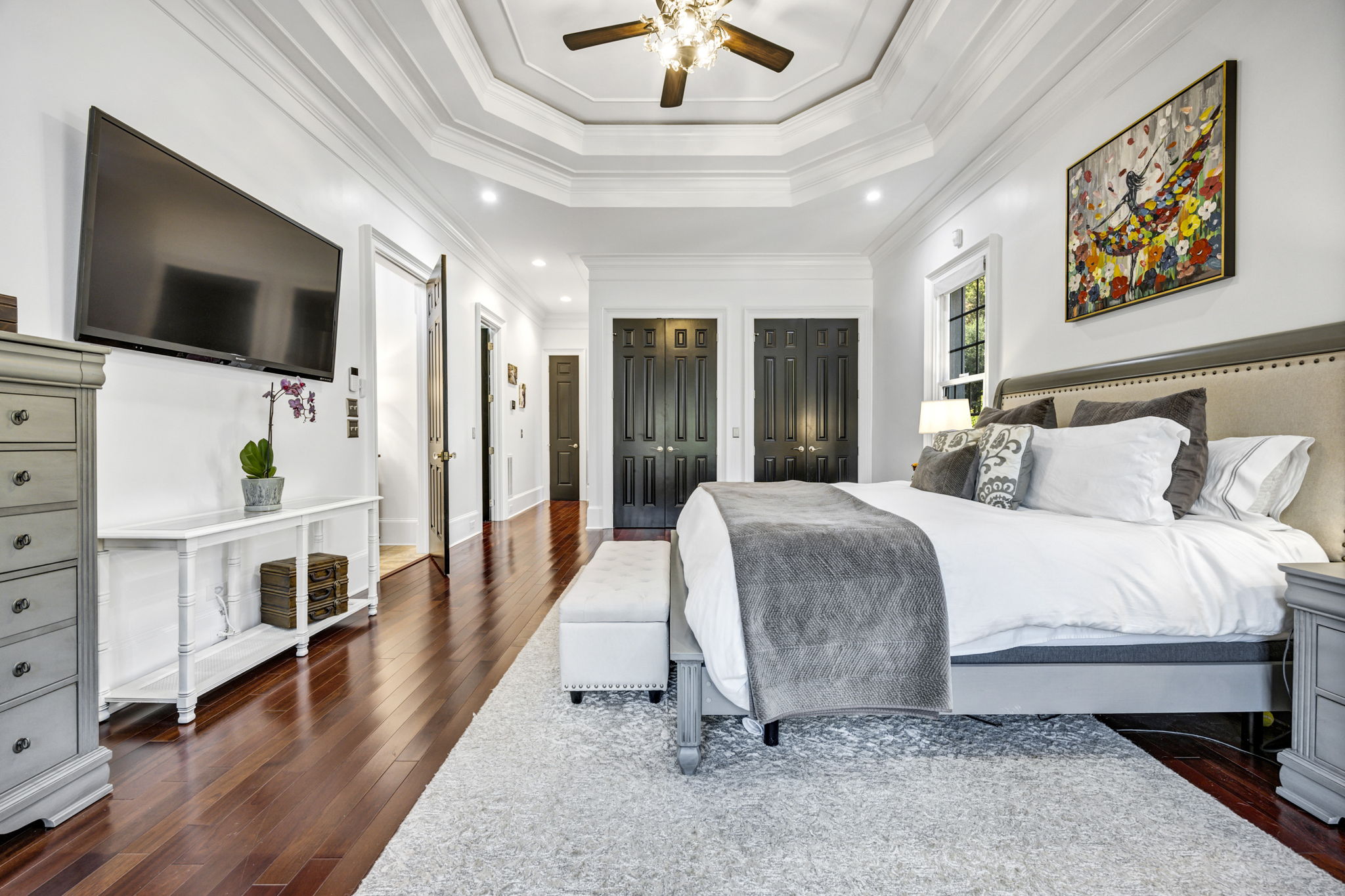 primary bedroom w double tray ceiling w rope lighting, 3 closets, 2 linen closets, ensuite bath