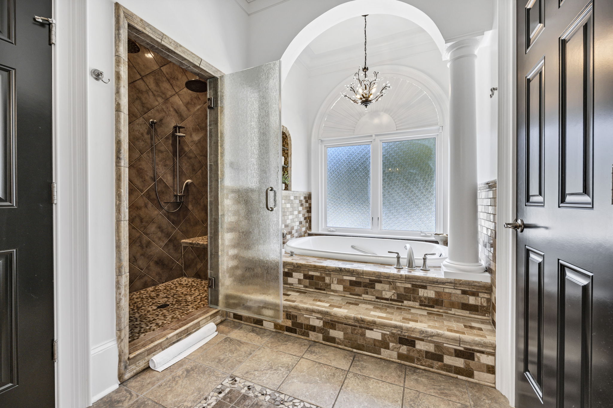 primary bath jetted tub; steam shower; WC has towel warming rack!