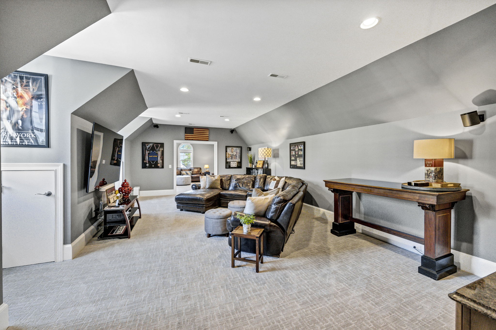 upstairs recreation rooms with new carpet, kitchenette and tons of eave storage