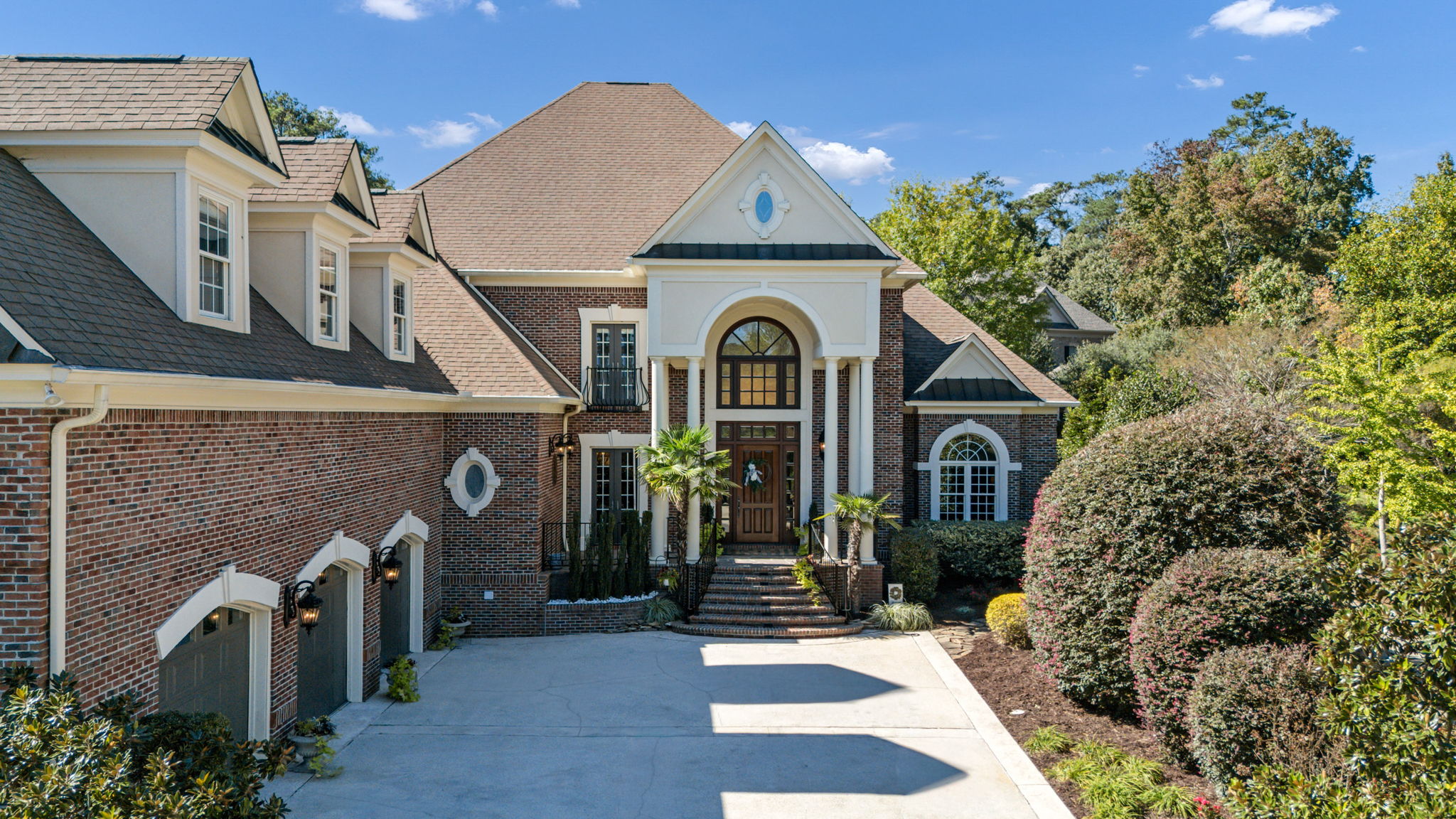 fantastic curb appeal with freshly painted garages and exterior doors and railings
