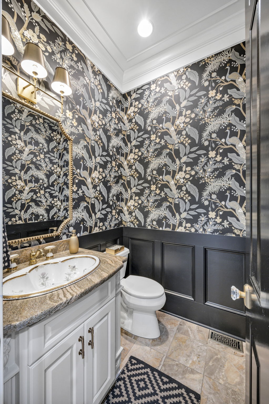 powder room w new wainscoting, mirror, lighting, and Anthropologie wallpaper