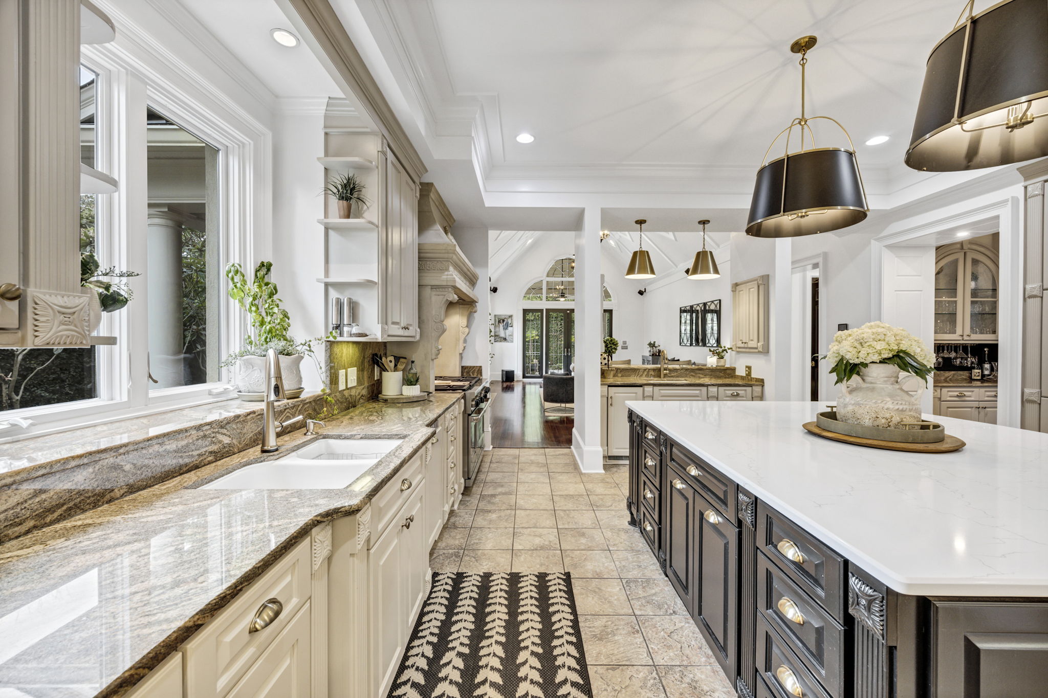 Sink with Delta champagne gold touch faucet; Miele dishwasher with 3 racks; Window shelf perfect for herbs or flowers