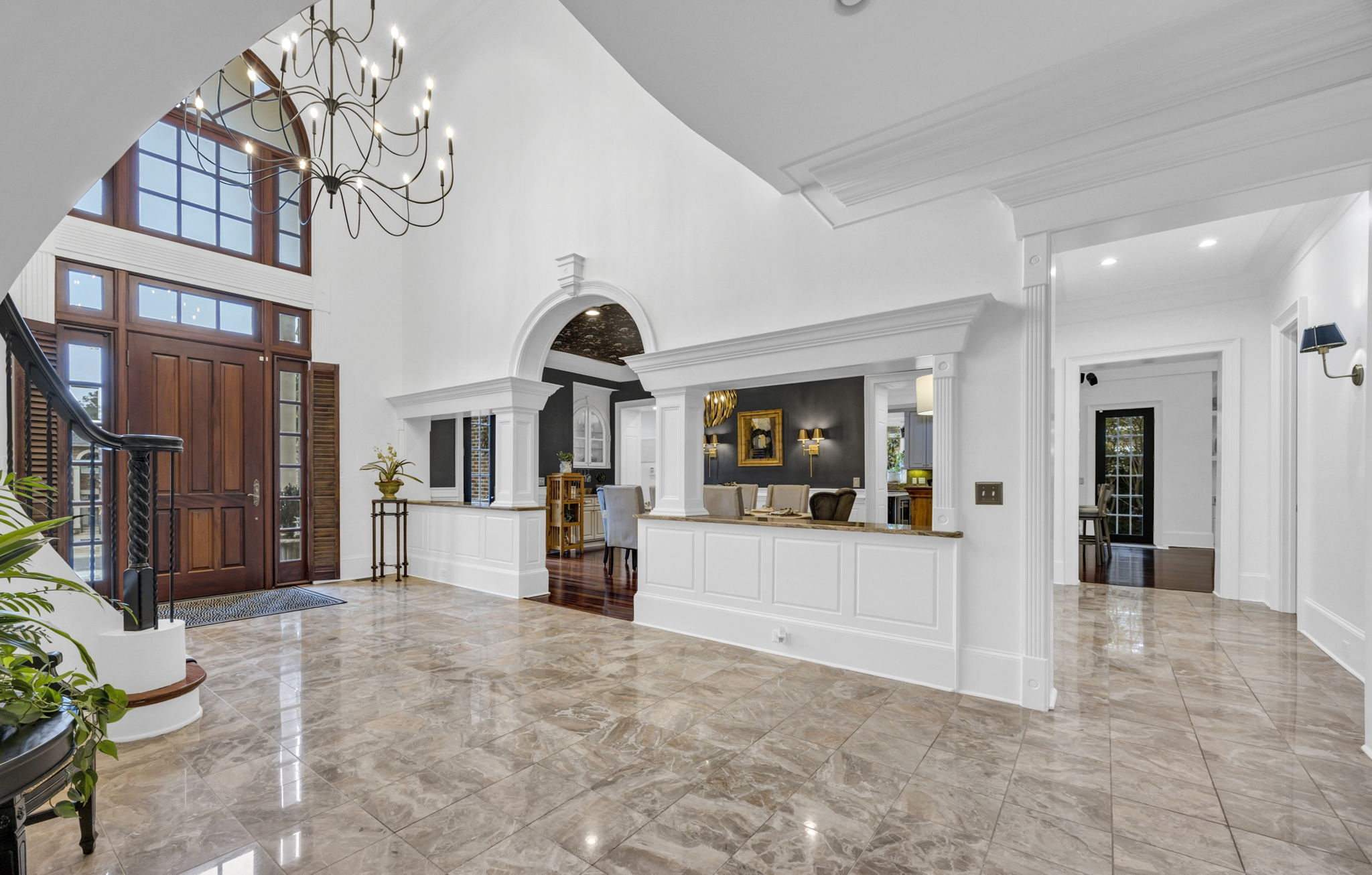 Marble Foyer with dining room and 1 of 2 corridors beyond