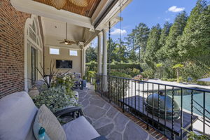 back porch from guest suite side - notice the rain chain and the 2 roller shades!