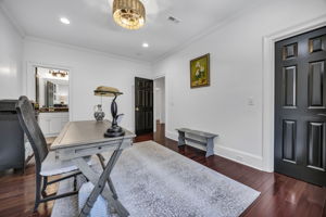 upstairs bedroom 1 w ensuite bath and walk-in closet with custom shelving