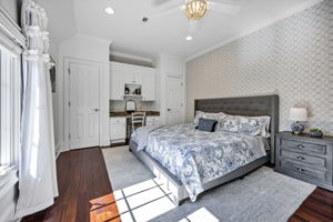 upstairs bedroom 3 w ensuite hall bath and built-in desk area, 2 closets