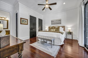 guest suite on main with 2 closets; 1 linen closet; ensuite bath; double french doors to back patio