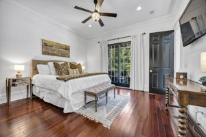 guest suite on main with sliding french doors to patio overlooking pool