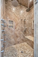 primary bath steam shower w double rainheads and 8 body spray jets