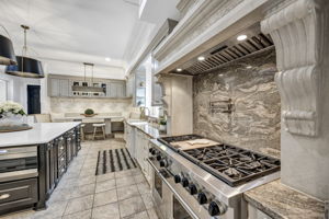 Wolf Dual Fuel 6-burner gas cooktop plus griddle and two electric ovens; Delta pot filler