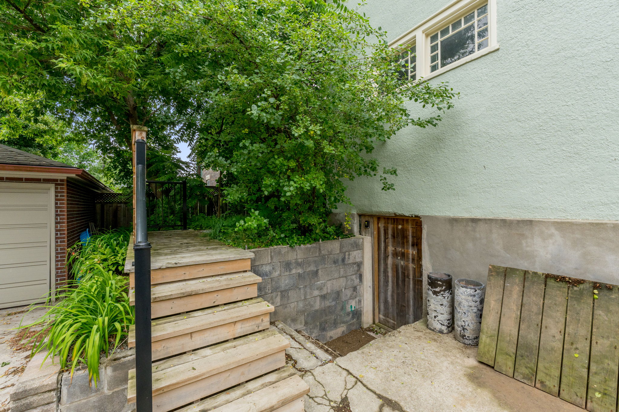 Stairs from parking to unit 1 and down to basement (shared laundry)