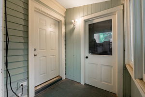 Front door to unit 1 and storage area