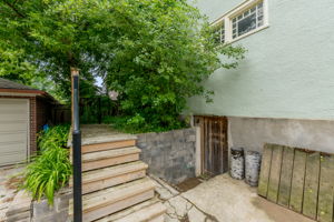 Stairs from parking to unit 1 and down to basement (shared laundry)