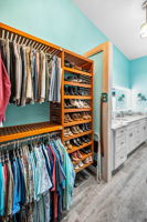 Upper Level Primary Bedroom Walk-in Closet1b