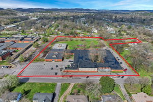 Lot 2 being sold AS IS. R4 zoning requires razing of existing school buildings on property. To be at Buyer's Expense to develop.