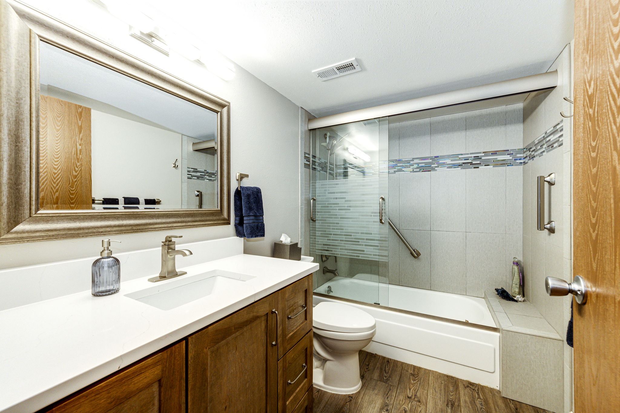 Full bathroom with a gorgeous quartz vanity sink